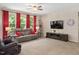 Inviting living room with large windows, comfortable seating, and a view of the green outdoors at 6512 Blalock Forest Dr, Willow Springs, NC 27592