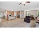 Open living room with a kitchen view, spacious layout, and a cozy recliner at 6512 Blalock Forest Dr, Willow Springs, NC 27592
