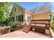 Wooden deck offers outdoor living space with steps down to backyard at 6728 Pointe Vista Cir, Raleigh, NC 27615