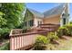 Backyard deck features railings and stairs with access to the home's back entrance at 6728 Pointe Vista Cir, Raleigh, NC 27615