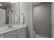 Bright bathroom with white vanity, gold fixtures, and a separate toilet room at 6728 Pointe Vista Cir, Raleigh, NC 27615