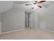 Neutral bedroom with light carpet, sloped ceiling, and ceiling fan at 6728 Pointe Vista Cir, Raleigh, NC 27615
