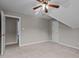 View of bedroom featuring a ceiling fan, carpet, and a doorway leading to an adjacent bathroom at 6728 Pointe Vista Cir, Raleigh, NC 27615
