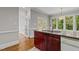 Kitchen area featuring granite countertops, wooden cabinets, and stainless sink at 6728 Pointe Vista Cir, Raleigh, NC 27615