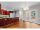 Bright open kitchen with granite counters, wooden cabinets, and stainless appliances at 6728 Pointe Vista Cir, Raleigh, NC 27615