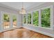 Bright sunroom with backyard views and access to the deck at 6728 Pointe Vista Cir, Raleigh, NC 27615