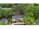 Birds eye view of a well-maintained community with mature trees and manicured lawns at 7719 Kingsberry Ct, Raleigh, NC 27615