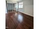 Neutral bedroom has a mirrored closet and lots of natural light at 7719 Kingsberry Ct, Raleigh, NC 27615