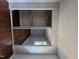Bedroom closet has an organized storage system with shelves and rods at 7719 Kingsberry Ct, Raleigh, NC 27615