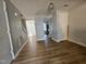 Bright living room with neutral paint, hardwood floors, and an open floor plan at 7719 Kingsberry Ct, Raleigh, NC 27615