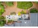 Aerial view of backyard featuring a stone patio, deck and lush landscaping at 8 Pine Top Pl, Durham, NC 27705