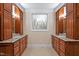 Bathroom with dual sinks, granite counters, and a decorative window at 8 Pine Top Pl, Durham, NC 27705