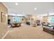 Spacious bonus room featuring a dining table, arcade machine, media center, and neutral carpeting at 8 Pine Top Pl, Durham, NC 27705