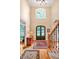 Bright foyer with hardwood floors, a staircase, and a large window above the entrance at 8 Pine Top Pl, Durham, NC 27705