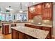 Well-appointed kitchen with granite countertops, custom island, and spacious layout at 8 Pine Top Pl, Durham, NC 27705