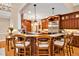 Spacious kitchen with granite countertops, island seating, and custom cabinetry at 8 Pine Top Pl, Durham, NC 27705