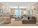 Comfortable living room featuring a plush sectional sofa, chaise lounge, and neutral carpeting at 8 Pine Top Pl, Durham, NC 27705