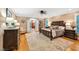 Bedroom with hardwood floors, a ceiling fan, and a door leading to the closet at 8 Pine Top Pl, Durham, NC 27705