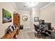 Organized office space with a desk, shelves, and a window offering natural light at 8 Pine Top Pl, Durham, NC 27705