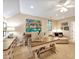 Home office with a large desk, colorful artwork, chaise lounge, and neutral carpet at 8 Pine Top Pl, Durham, NC 27705