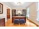 Home office with hardwood floors, custom built-ins, and a large executive desk at 8 Pine Top Pl, Durham, NC 27705