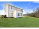 Large backyard with lush lawn, showcasing the home's exterior and spacious outdoor living area at 89 Merle Way, Wendell, NC 27591