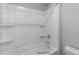 Bright bathroom showcases a streamlined tub and shower combination at 89 Merle Way, Wendell, NC 27591