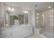 Modern bathroom featuring double vanity, glass shower, and luxurious finishes at 89 Merle Way, Wendell, NC 27591