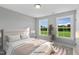 Inviting bedroom with two bright windows offering an abundance of natural light at 89 Merle Way, Wendell, NC 27591