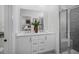 Contemporary bathroom with double vanity, neutral tiles, and a glass-enclosed shower at 1003 Regalia Rd # 33, Durham, NC 27713