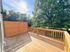 Wooden deck surrounded by privacy fence and lush greenery at 1003 Regalia Rd # 33, Durham, NC 27713