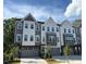 Stylish townhome with gray and white siding and individual garages at 1003 Regalia Rd # 33, Durham, NC 27713