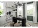 Chic home office showcasing a sleek black desk, decorative shelves, and natural light at 1003 Regalia Rd # 33, Durham, NC 27713