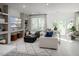 Bright and airy living room with contemporary decor, large windows, and a comfortable white sofa at 1003 Regalia Rd # 33, Durham, NC 27713