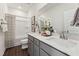 This bathroom features double sinks, white cabinets, and a shower/tub combination at 101 Ailey Brook Way # 200, Wake Forest, NC 27587