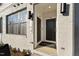 This townhome features a light brick entryway with black front door and contemporary black exterior lights at 101 Ailey Brook Way # 200, Wake Forest, NC 27587