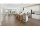 Modern kitchen featuring a large island with seating, stainless steel appliances, and eat-in dining area at 101 Ailey Brook Way # 200, Wake Forest, NC 27587