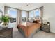This main bedroom has a lot of sunlight, carpet, and neutral curtains at 101 Ailey Brook Way # 200, Wake Forest, NC 27587