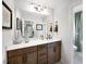 Modern bathroom featuring long vanity with light wood cabinets and view into the shower at 1020 Dillon Lake Dr, Knightdale, NC 27545