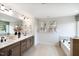 Spacious primary bathroom featuring dual sinks, a soaking tub, and a separate shower at 1020 Dillon Lake Dr, Knightdale, NC 27545