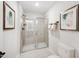 Modern bathroom with glass enclosed shower, neutral wall art, and a toilet at 1020 Dillon Lake Dr, Knightdale, NC 27545