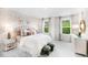 Charming bedroom with floral wallpaper, soft textures, and a comfortable bed with decorative pillows at 1020 Dillon Lake Dr, Knightdale, NC 27545