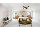 Brightly decorated bedroom features stylish chairs, a cozy bed, and ample natural light at 1020 Dillon Lake Dr, Knightdale, NC 27545