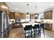 Beautiful kitchen with stainless steel appliances, island with seating, and pendant lighting at 1020 Dillon Lake Dr, Knightdale, NC 27545