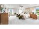 Spacious bedroom with tray ceiling, neutral palette, and two windows with bench seating at 1020 Dillon Lake Dr, Knightdale, NC 27545