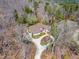 Aerial view of an estate home showing the circular driveway and beautiful landscaping at 10210 Governors Drive Dr, Chapel Hill, NC 27517