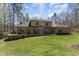 Large backyard featuring an outdoor patio and lush green lawn at 10210 Governors Drive Dr, Chapel Hill, NC 27517