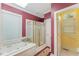Modern bathroom with soaking tub, glass shower, and ample natural light at 10210 Governors Drive Dr, Chapel Hill, NC 27517
