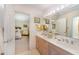 Bathroom featuring a double sink vanity with a view into the bedroom at 10210 Governors Drive Dr, Chapel Hill, NC 27517
