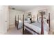 Bedroom with two comfortable four-poster beds with floral bedding and ensuite bath at 10210 Governors Drive Dr, Chapel Hill, NC 27517
